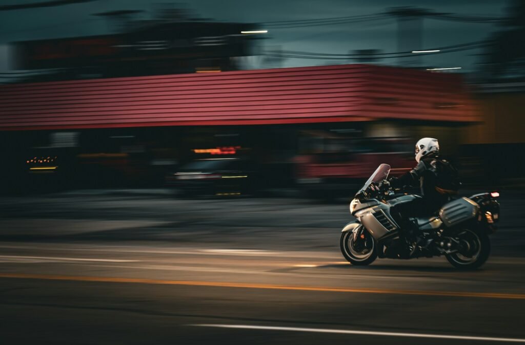 A person riding a motorcycle on a city street