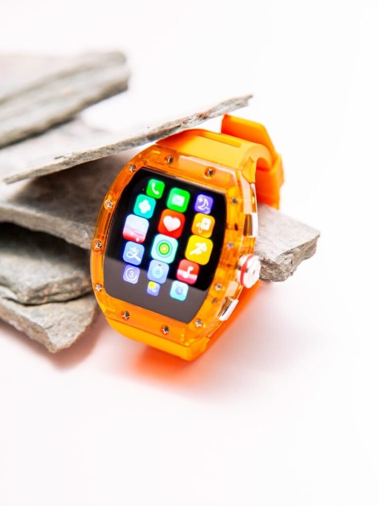 a smart watch sitting on top of a piece of paper